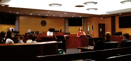 Judge Lark Cowart talks with Geneva Community High School students during a recent visit from their Business class.