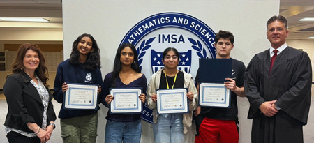 Illinois Math and Science Academy Law Day Essay Contest winners (center) with Kane County Bar Foundation Executive Director Ann Lobb (left) and Chief Judge Robert Villa (right) presenting the awards at their high school.