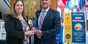 Chief Judge Robert Villa (right) presents the first annual 16th Judicial Circuit Law Day Spirit Award to Kane County attorney Julie Cibulskis (left). The award is given in recognition of an individual (or individuals) who exemplify the principles of the